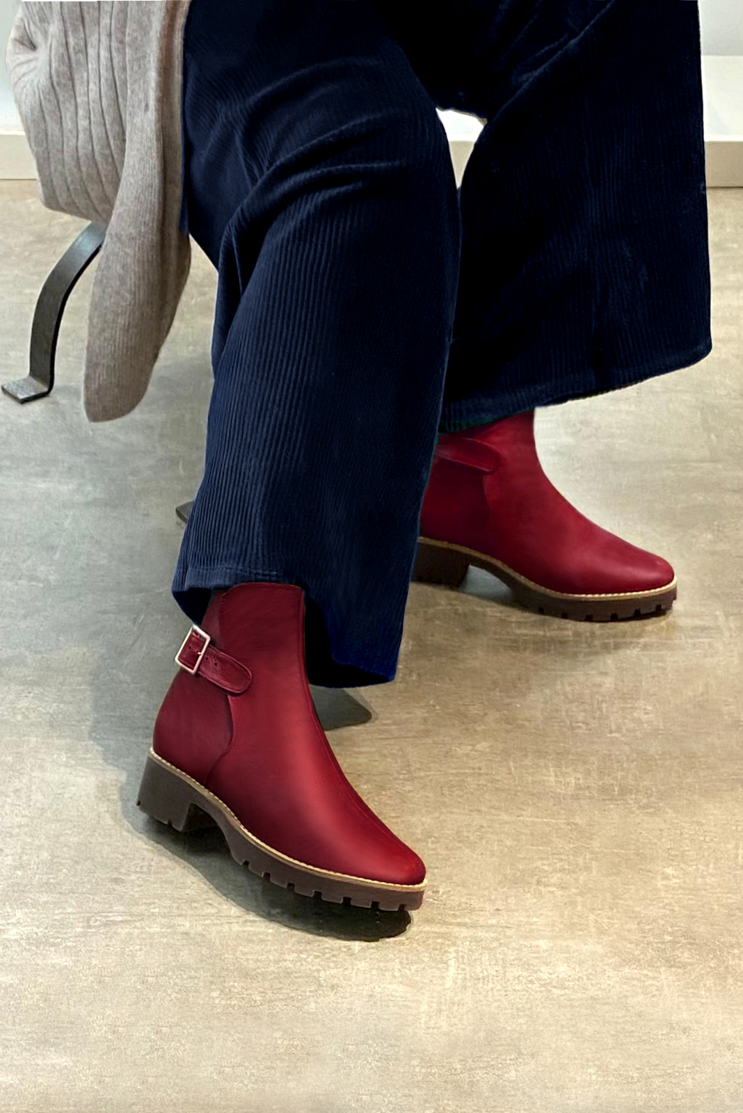 Cardinal red women's ankle boots with buckles at the back. Round toe. Low rubber soles. Worn view - Florence KOOIJMAN
